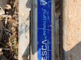 a blue and white sign on the side of a building