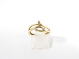 a close up of a gold ring with a diamond on it
