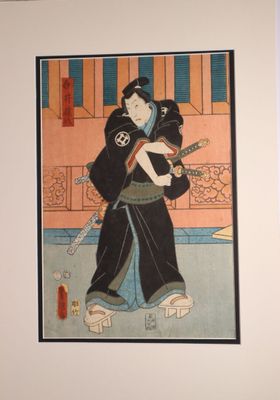 a picture of a woman holding a cat in her arms