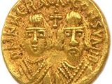 une pièce d'or sur laquelle figurent un homme et une femme