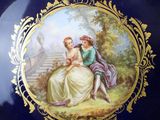 a blue plate with a picture of a couple on it