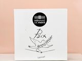 a white box with a drawing of a bird on it