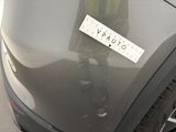 a sticker on the hood of a car with a sticker on it