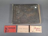 an old book with writing on it sitting next to a box of cigarettes