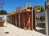 a construction site with scaffolding and scaffolding on the side of the building