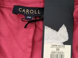 a close up of a pink pants with a tag on it