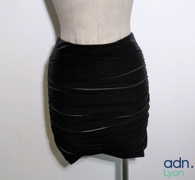 a mannequin on a mannequin stand with a dress on it