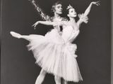 an old black and white photo of two ballerinas in tutuss