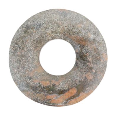 a donut that is sitting on a white surface