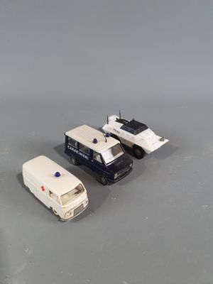 two toy cars that are sitting next to each other on a table