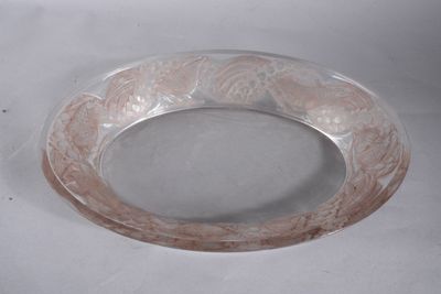 a clear glass bowl with a pink design on it