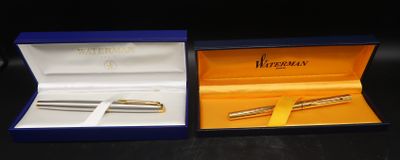 a box with a pen inside of it and a pen in it