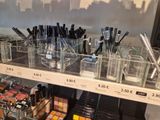 a display of cosmetics and makeup products in a store