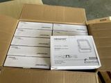 many boxes of electronic devices stacked on top of each other