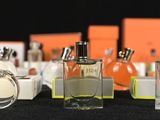 many different perfume bottles lined up on a table