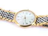 an image of a gold and silver wrist watch on a white background