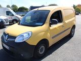a yellow van that is parked in a parking lot