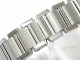 a close up of a watch bracelet on a white surface