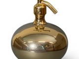 a golden soap dispenser on a white background