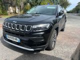 the jeep compass is parked on the side of the road