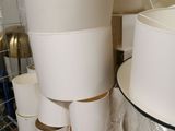 a stack of cups sitting on a shelf in a room