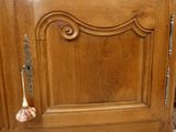 a wooden cabinet with a door handle on it