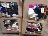 two boxes of clothes that are stacked on top of each other