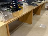 many computers on the desks in this room