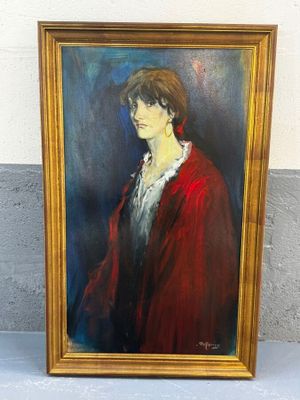 tableau représentant une femme vêtue d'un manteau rouge, dans un cadre doré