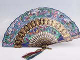 a blue and gold fan with a tassel on top of it