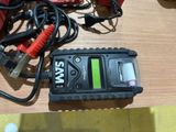 an image of a battery charger on a wooden table