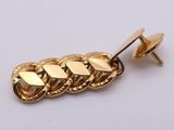 an image of a close up of a gold plated pin