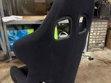 a black seat with a hole in the middle of it