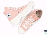 pink converse sneakers with white laces and a star on the side