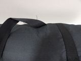 a close up of a black bag with a strap