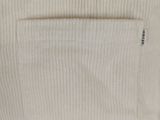 the back of a white sweater with a pocket on it