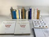 many books that are sitting on a table