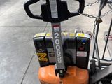 a small machine that is sitting on the sidewalk