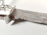 a knife that is laying on a table