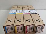 four boxes of ink cartridges are stacked on top of each other