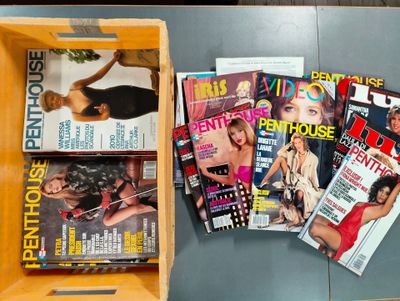 a lot of magazines in a wooden box on a table