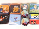 many tins of tins with cartoon characters on them