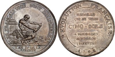 a silver coin with a picture of a man on it