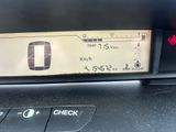 the dashboard of a car with a digital display on it