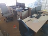 a desk with two computer monitors and a keyboard on it