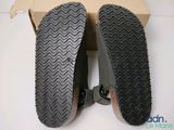 pair of men ' s shoes in a cardboard box on a white surface