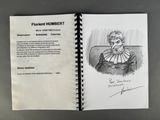 an open book with a drawing of a woman sitting on a couch