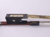 a bow and a bow rest on a white surface