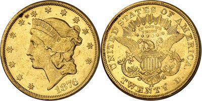 a gold coin with a woman ' s head and eagle on it