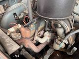 a close up view of an old car engine with a lot of rust
